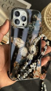 قاب موبایل آیفون پروانه ترنسپرنت مشکی پولکی طلایی