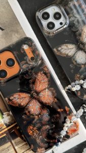 قاب موبایل آیفون پروانه ترنسپرنت مشکی پولکی طلایی - تصویر 2